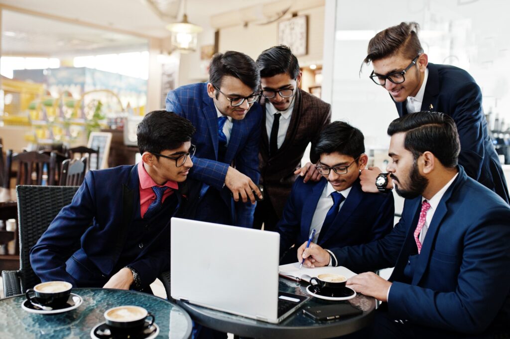 collaborative-process-indian-business-mans-during-brainstorming-meeting-officediverse-team-young-people-dressed-suits-cooperating-developing-common-project-min-scaled